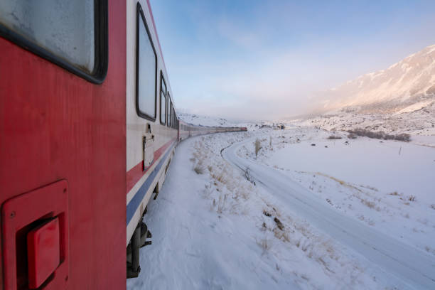 istock train moving on snowy railway track 1193620112