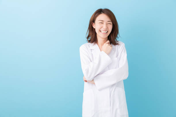 istock asian woman in a white coat 1193624380