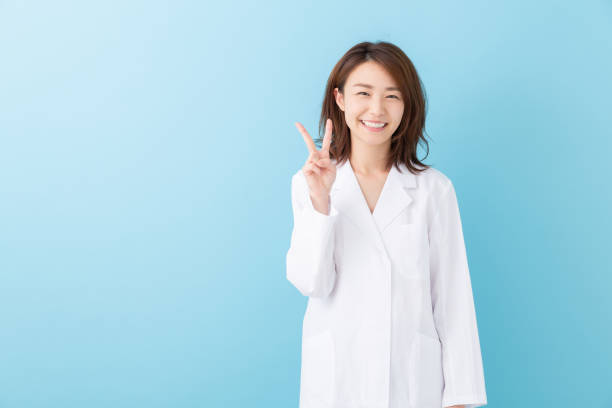 istock asian woman in a white coat 1193624442