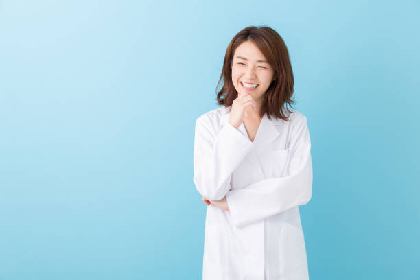 istock asian woman in a white coat 1193624454