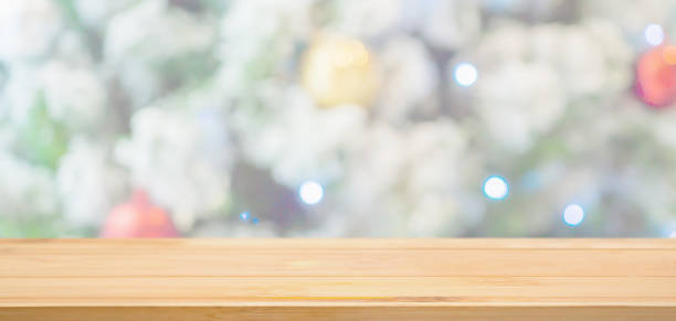 istock Empty wood table top with Abstract blur Christmas tree with decoration bokeh light background for product display 1193625304