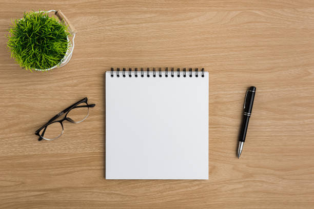 istock Top view Wood office desk table. Flat lay Workspace 1193627235