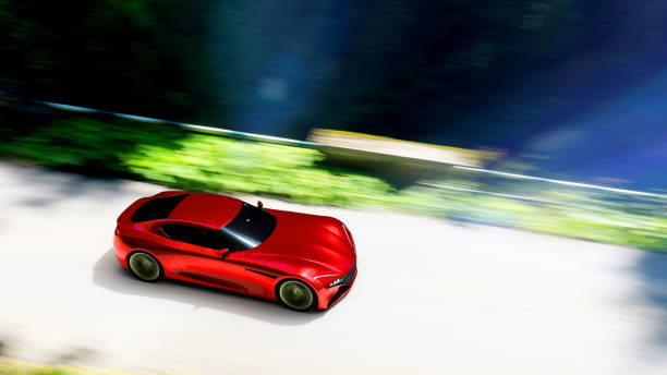 istock red car driving on a forest road 1193627257