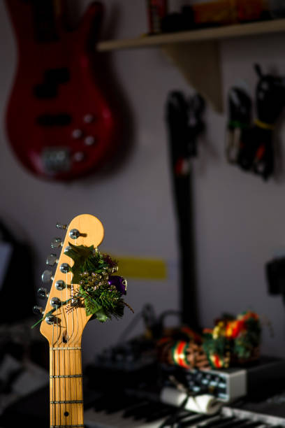 istock Colorful christmas decorations attached to an elecric guitar. 1193629193