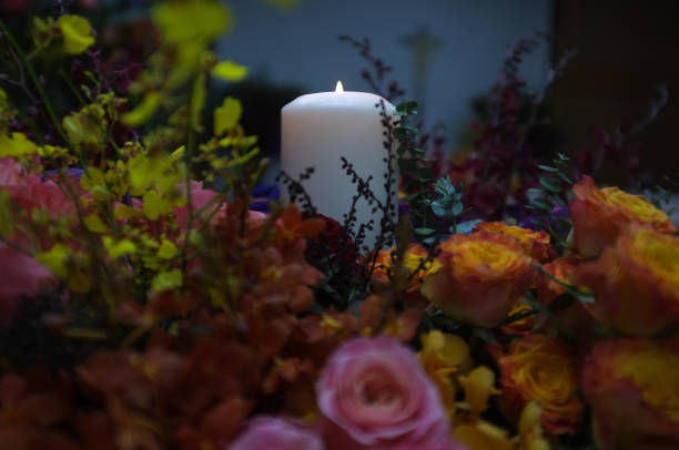 istock Flaming candles and flowers decoration 1193631052