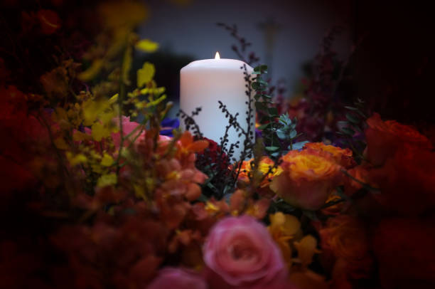 istock Flaming candles and flowers decoration 1193631054