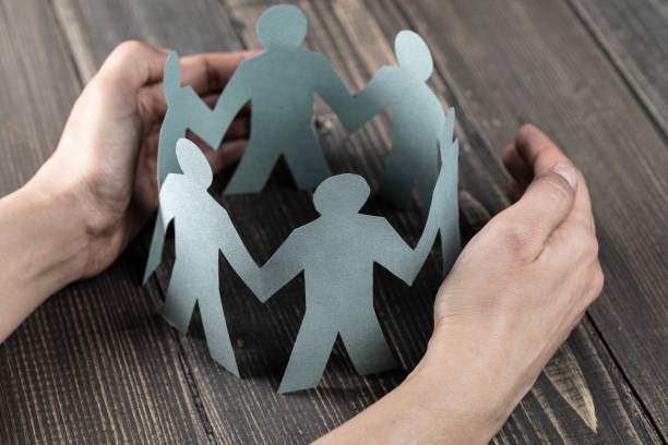 istock Hand Protecting Paper Cut Out Figure 1193637731