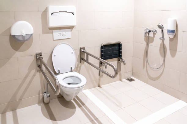 istock Public restroom for disabled handicapped people with special equipment 1193637757