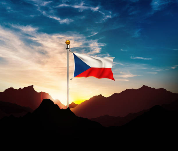 Flag of the Czech Republic close up with a clear blue sky.