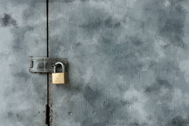 istock Old keys on painted wooden doors. 1193643338