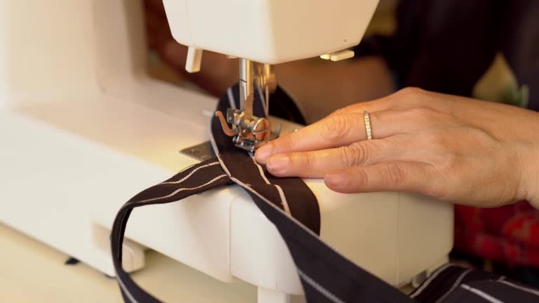Asian women sewing at home