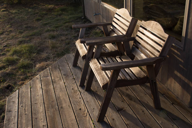istock Two wood chairs on a deck outside 1193648381