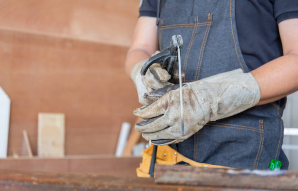 Selective focus of welding electrode holders with welding wire in worker hand, Craftsman concept Selective focus of welding electrode holders with welding wire in worker hand, Craftsman concept animal skin flash stock pictures, royalty-free photos & images