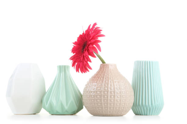 istock Different ceramic vases with gerbera flower isolated on white background 1193662546