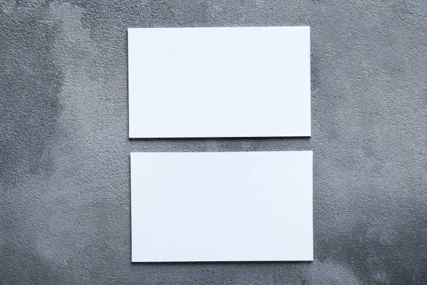 istock Blank business cards on gray background 1193663247