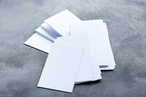 istock Blank business cards on gray background 1193665465