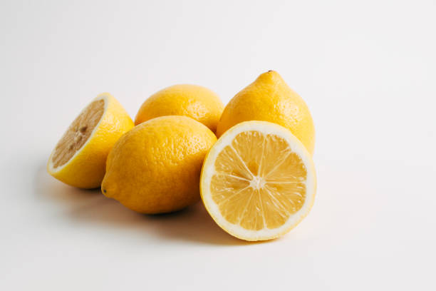 istock Lemon whole fruits and halves on a white background 1193666672