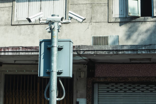 istock Security camera and urban video, CCTV with retro building background 1193668080