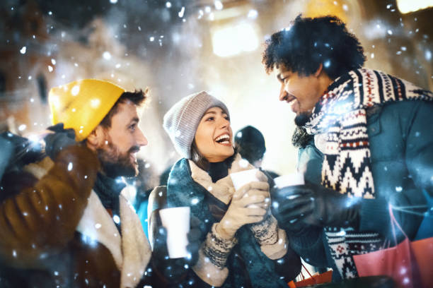 istock Friends having fun on a snowy December night. 1193668660