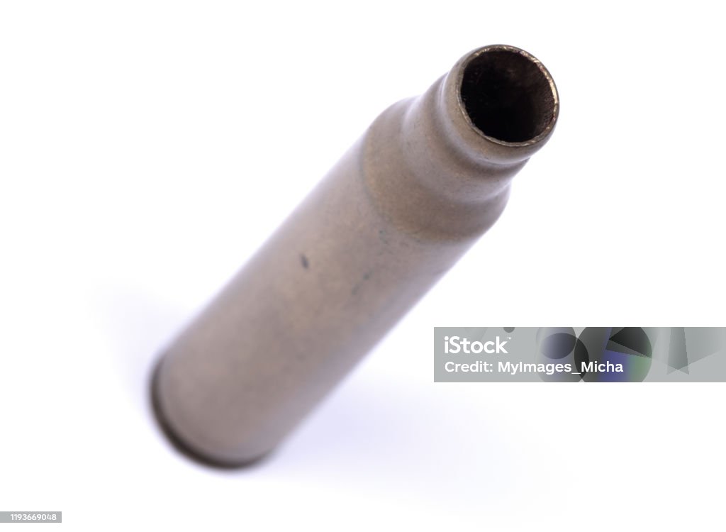 Isolated macro shot of M-16 5. 56mm cartridge, isolated on white Ammunition Stock Photo
