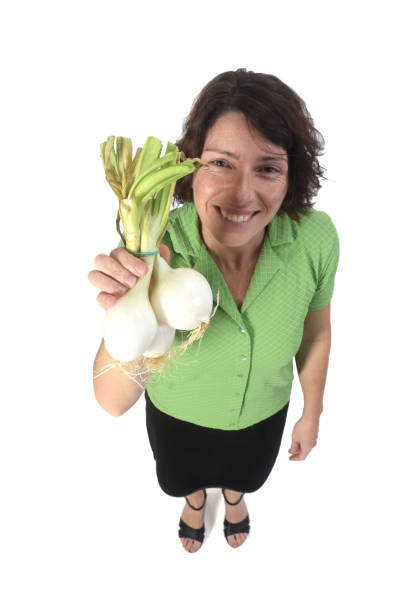 istock woman with vegetables on white background 1193669170