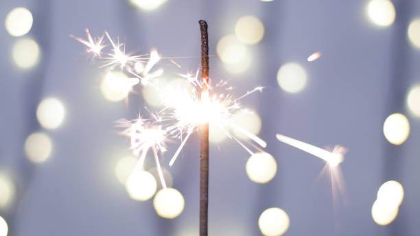 Close-up of firework sparkler burning. Fireworks burn on a blue background