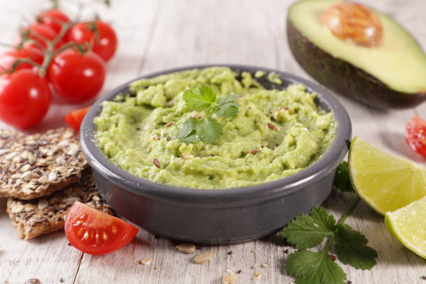 istock homemade guacamole with bread, tomato and lime 1193671208