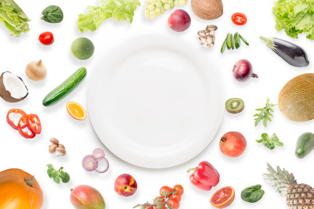 istock Healty eating, vegatables, fruits, empty plate 1193671273