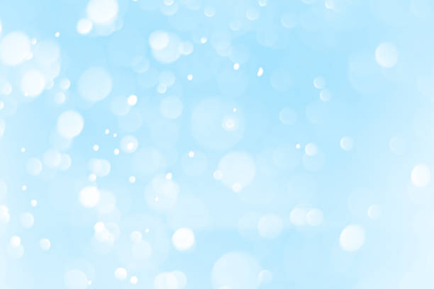istock Bright blue bokeh for snow background design. 1193671937