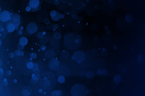 istock Christmas blue bokeh on a black background, Abstract. 1193672193