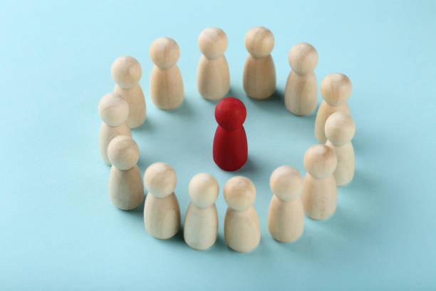 istock Leader concept. Wooden figures on blue background 1193675685