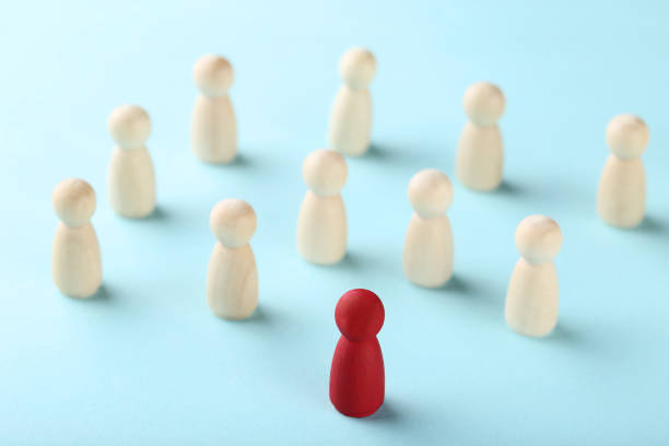 istock Leader concept. Wooden figures on blue background 1193676549