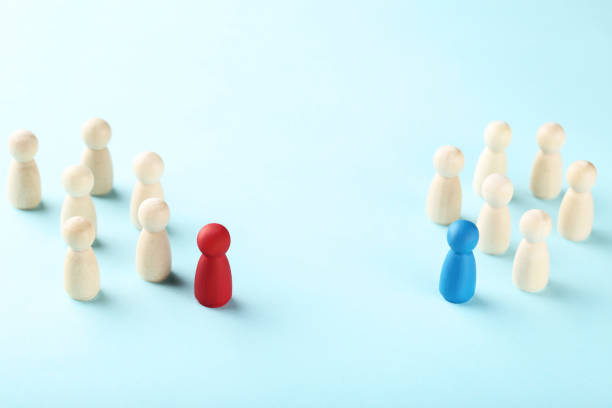 istock Leader concept. Wooden figures on blue background 1193676635