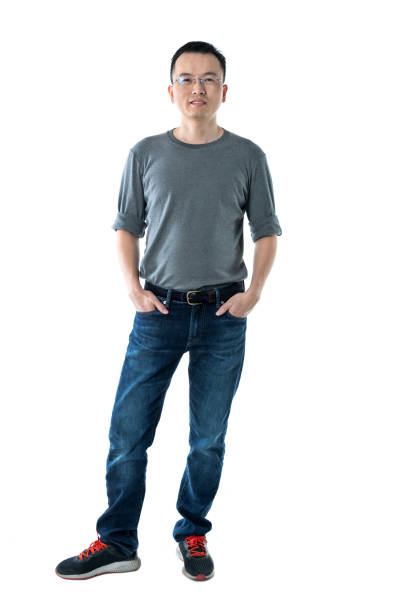 istock Man standing with hands in pockets on white background 1193682931