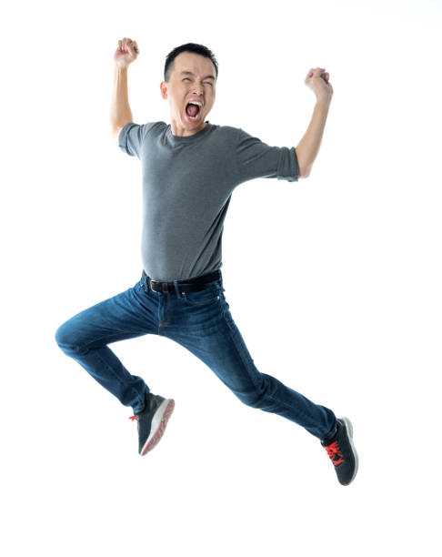 istock Excited man jumping on white background 1193683329