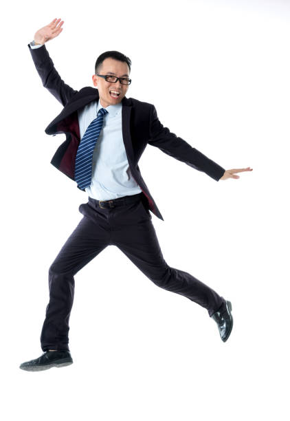 istock Cheerful businessman dancing on white background 1193683584
