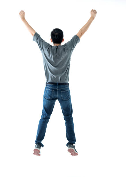 istock Excited man jumping and cheering on white background 1193683698