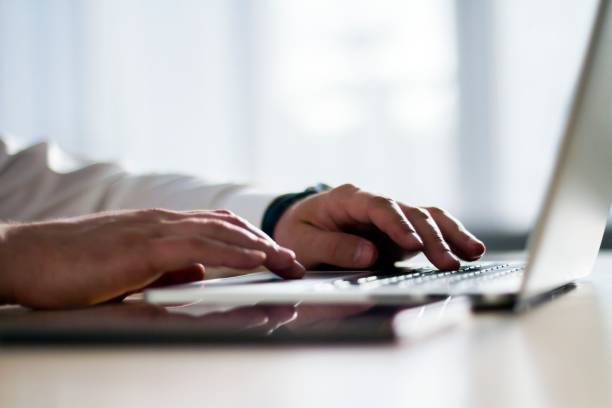 istock Closeup of man hands typing on a laptop, working concept 1193685022