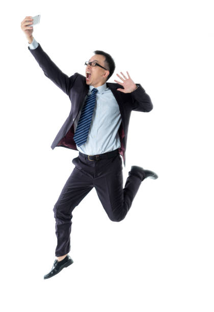 istock Businessman taking a selfie on white background 1193686606