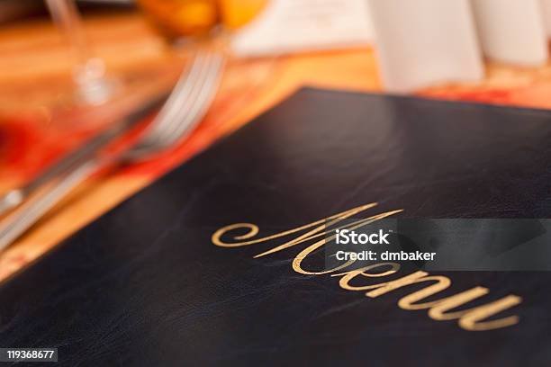 Menu On A Restaurant Table Next To Knife And Fork Stock Photo - Download Image Now - Menu, Restaurant, Cafe