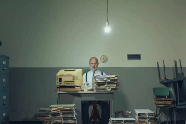 istock Frustrated businessman overloaded with paperwork 1193687406