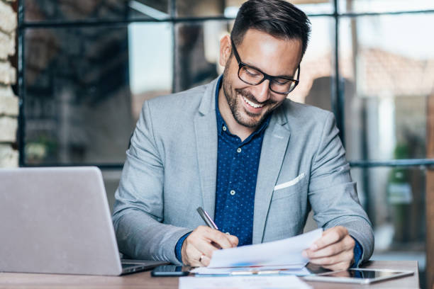 istock Young businessman working at office 1193688722