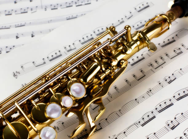 istock Soprano Saxophone Close Up over musical notes 1193690054