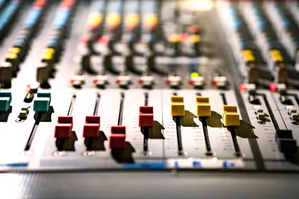 Photo of Old sound recording mixing desk at live concert