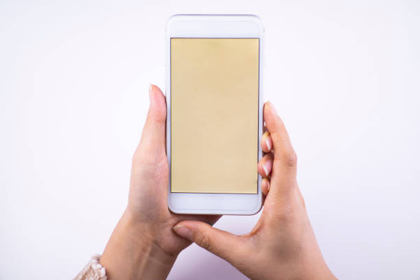 istock The woman's hand is holding the cell phone, and it's working 1193694369