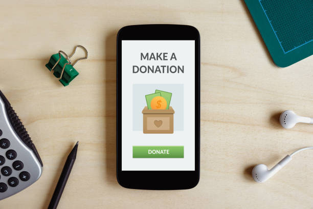 Donation concept on smart phone screen stock photo