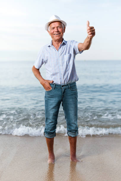 istock Satisfied smiling mature man giving thumbs up 1193694850