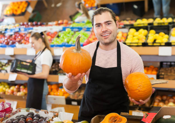 istock Fine man with pumpkin in hands 1193694967
