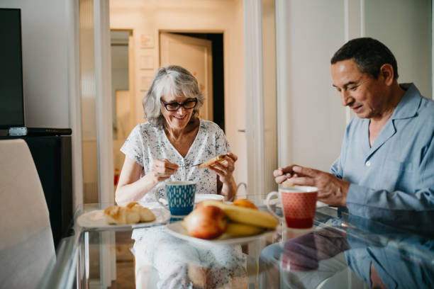 istock Wife and husband doing breakfast together at home 1193697925