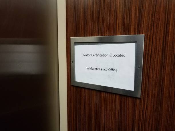 istock paper elevator certification is located in maintenance office sign 1193698648